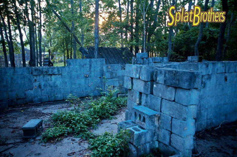 The Village Field A stone wall with the words splat brothers written on it