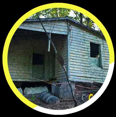 An old house with a yellow circle around it
