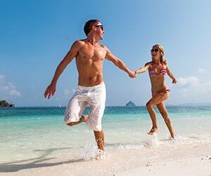 Couple in the beach — Orthopedic in Tampa, FL
