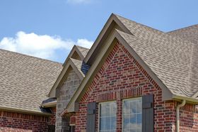 Roof Line of a House with Gabels Installing Roof Shingles — Warren, OH — J&B Spouting and Roofing LLC