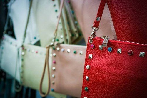 borse in pelle rosse e beige