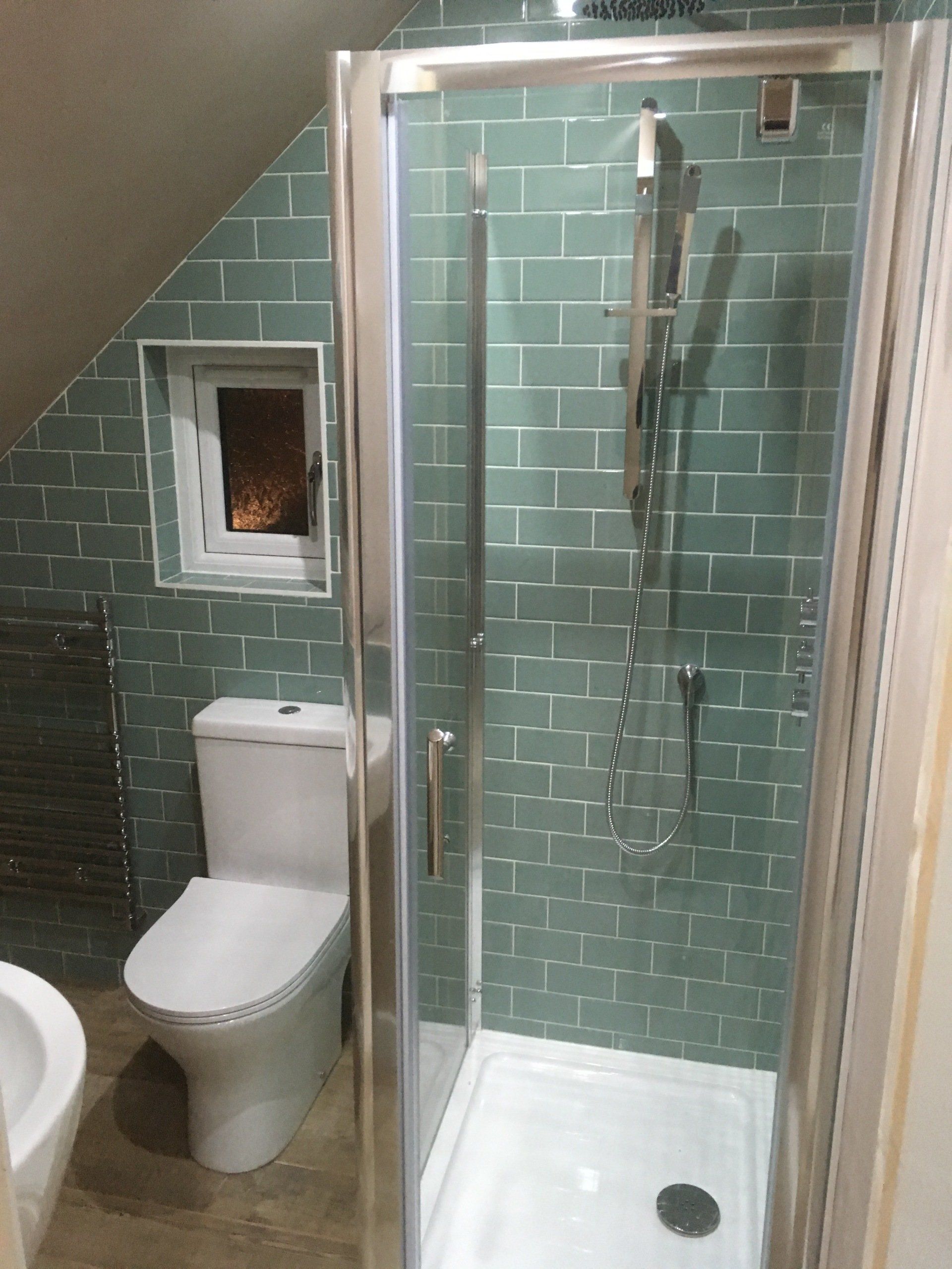 A completed bathroom and shower installation