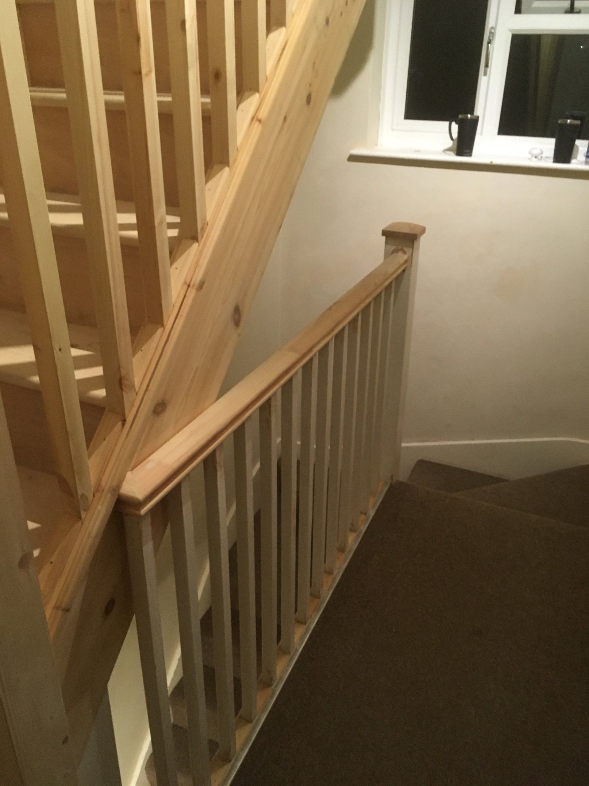 A new handrail and spindles on a staircase.