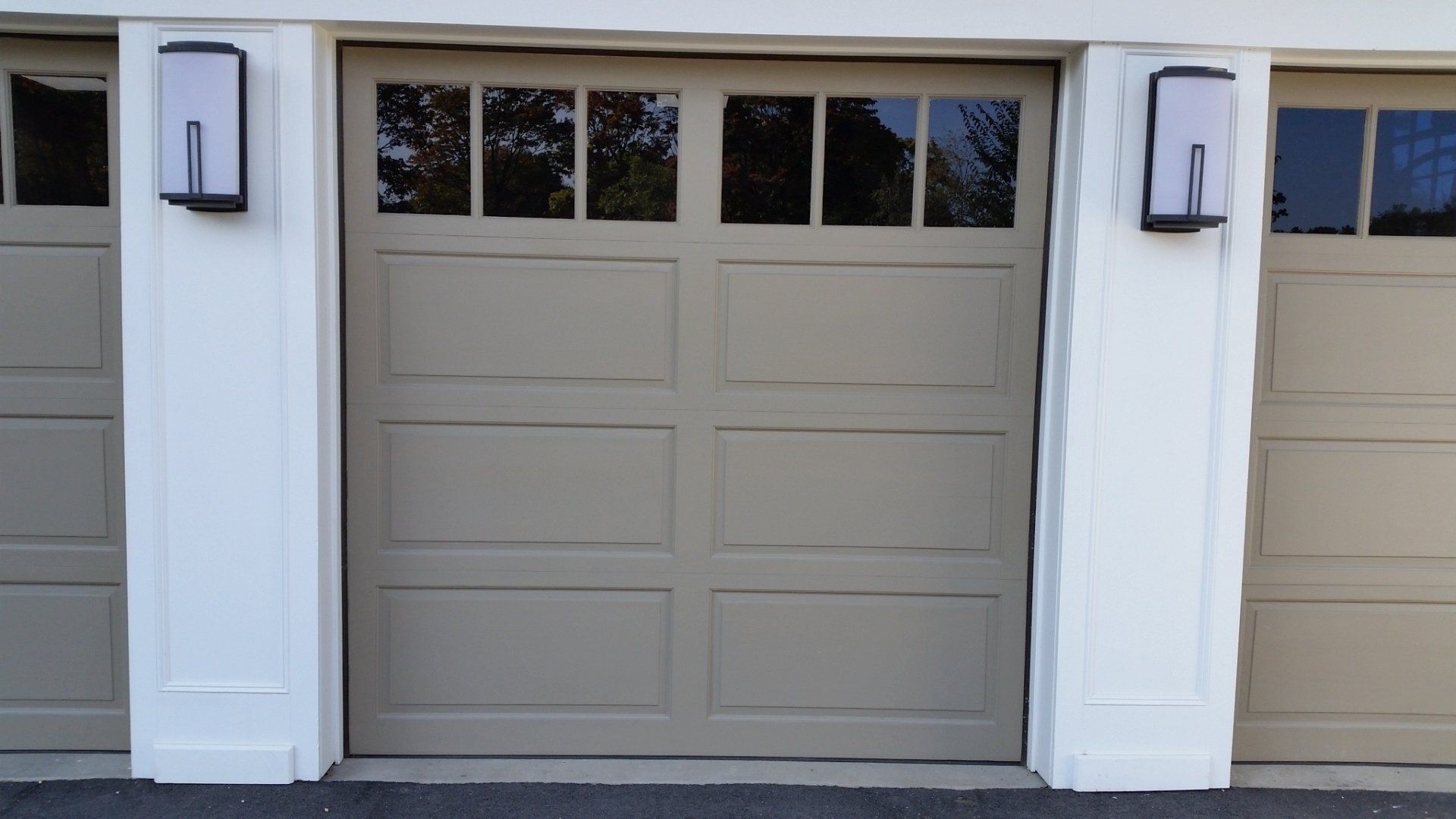 symmetrical garage door with windows in Old Westbury, NY