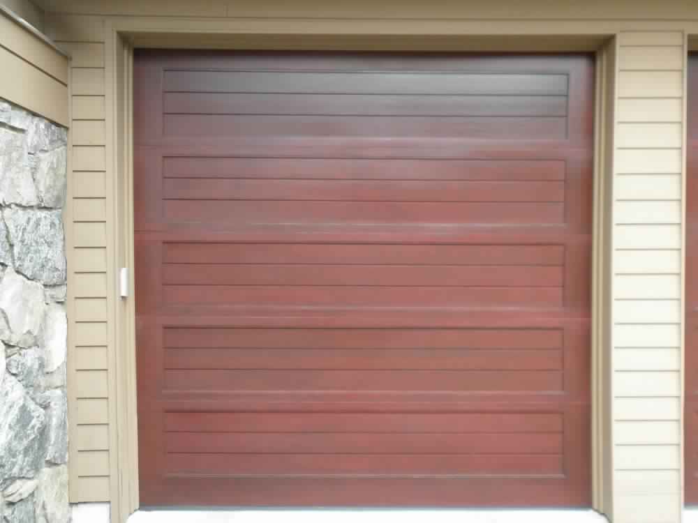 dark wood garage door installation in Upper Brookville, NY
