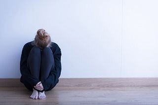 Girl sitting curled up — Psychological Counseling in Bethlehem, PA Girl sitting curled up — Psychological Counseling in Bethlehem, PA