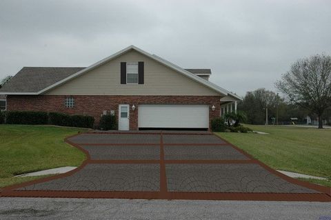 Driveway Sealing Company — Plants Along Cobblestone Driveway in Lakeland, FL Driveway Sealing Company — Plants Along Cobblestone Driveway in Lakeland, FL