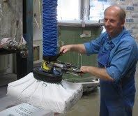 Expert demontrating lifting sack with vacuum lift in NZ