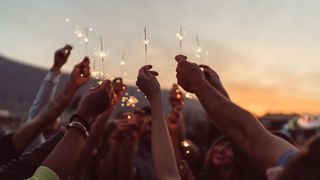friends with sparklers celebrating
