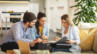 couple signing lease paperwork