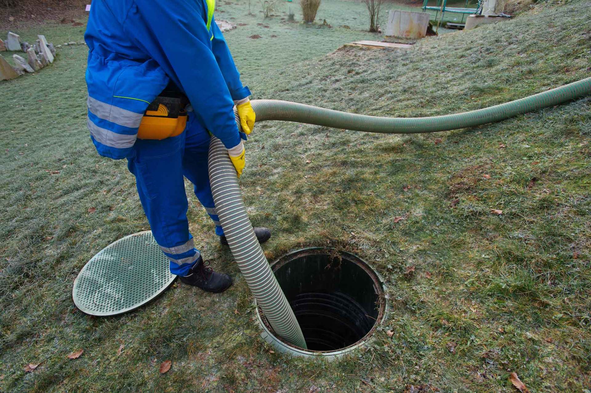 Worker Cleaning the Septic Tank — Baldwinsville, NY — Aces-Four Septic Service