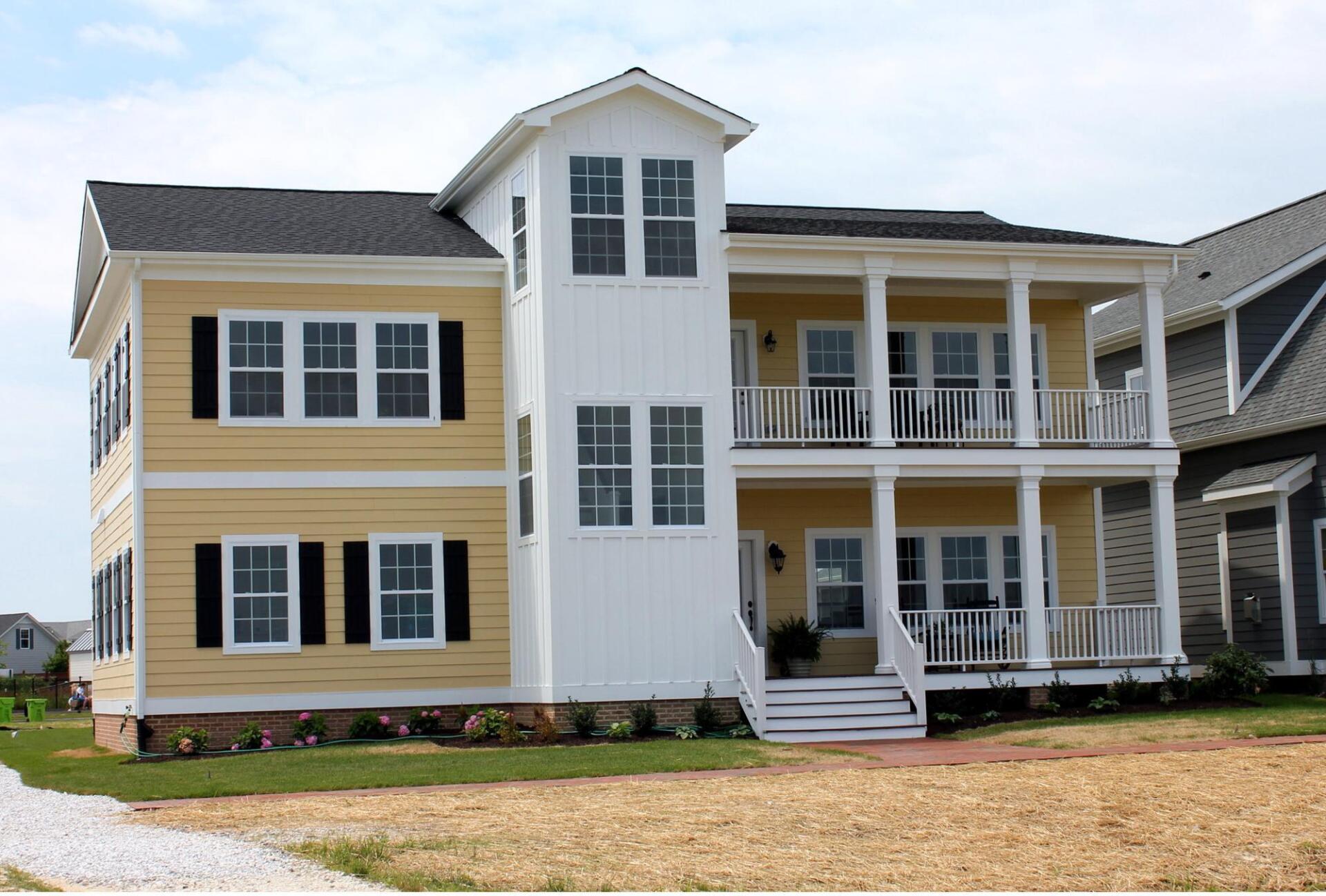 Yellow two story home exterior | Harbour Town Executive | Covell Communities | Chester, Maryland 21619