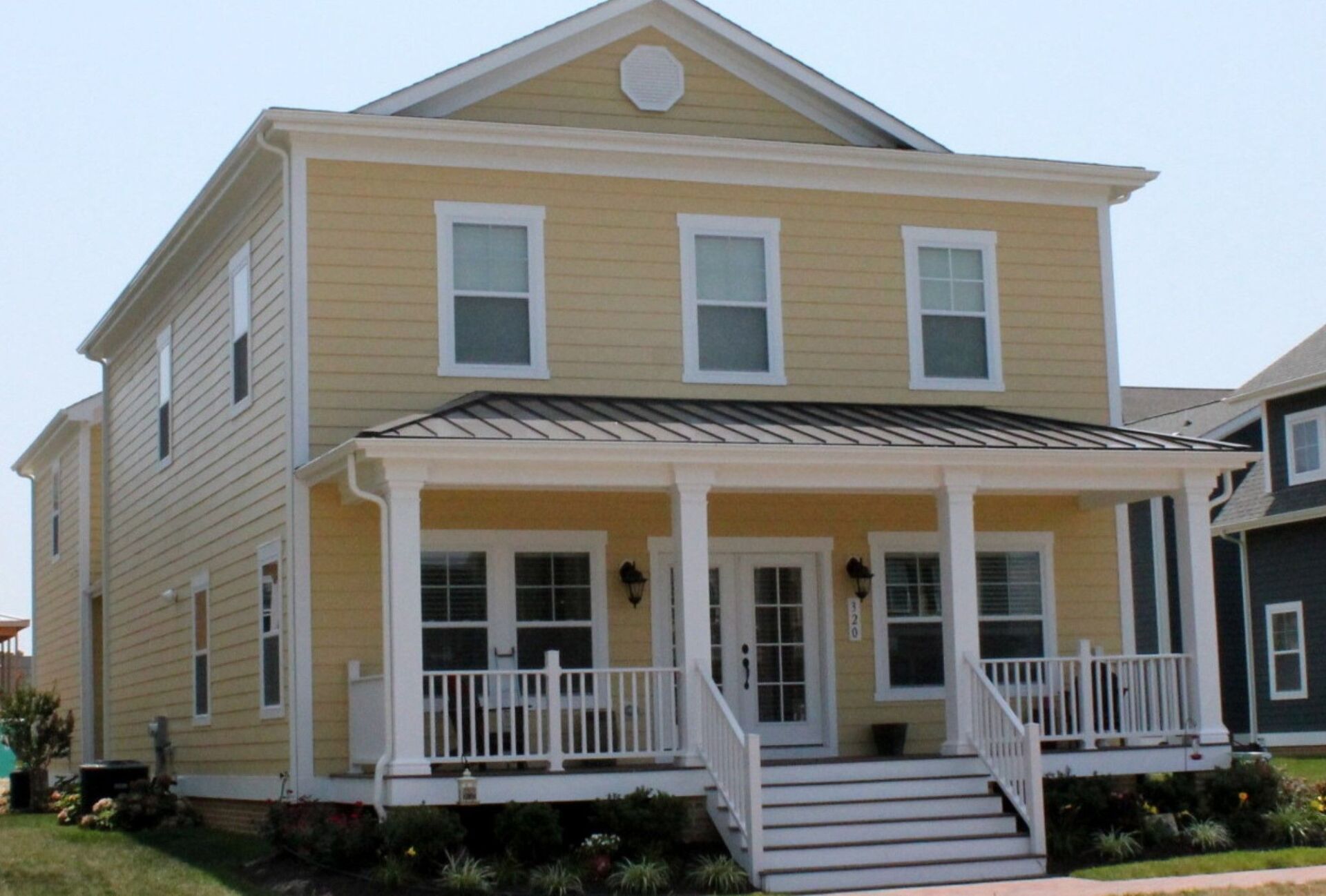 Yellow two story home exterior | Kitty Hawk Classic | Covell Communities | Chester, Maryland 21619