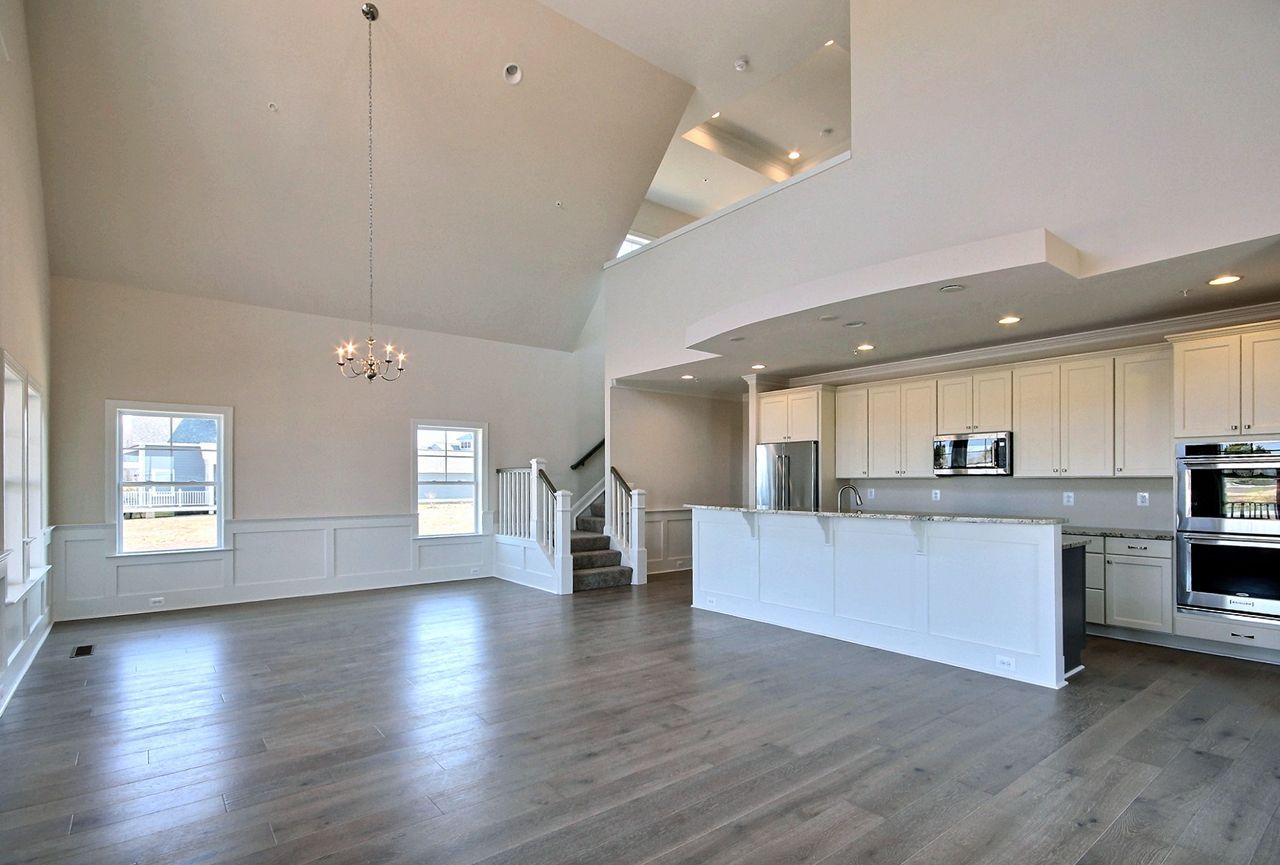 Vaulted living room with kitchen and island | Sawgrass Legacy | Covell Communities | Chester, Maryland 21619