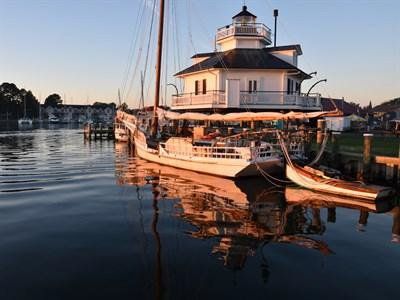Large sailboat near lighthouse | Eastern Shore History | Covell Communities | Chester, Maryland 21619
