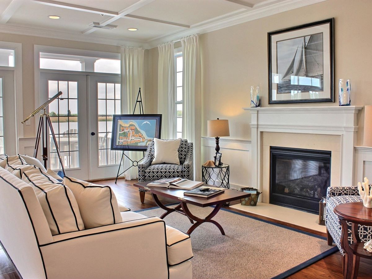A living room with a fireplace couch and chairs