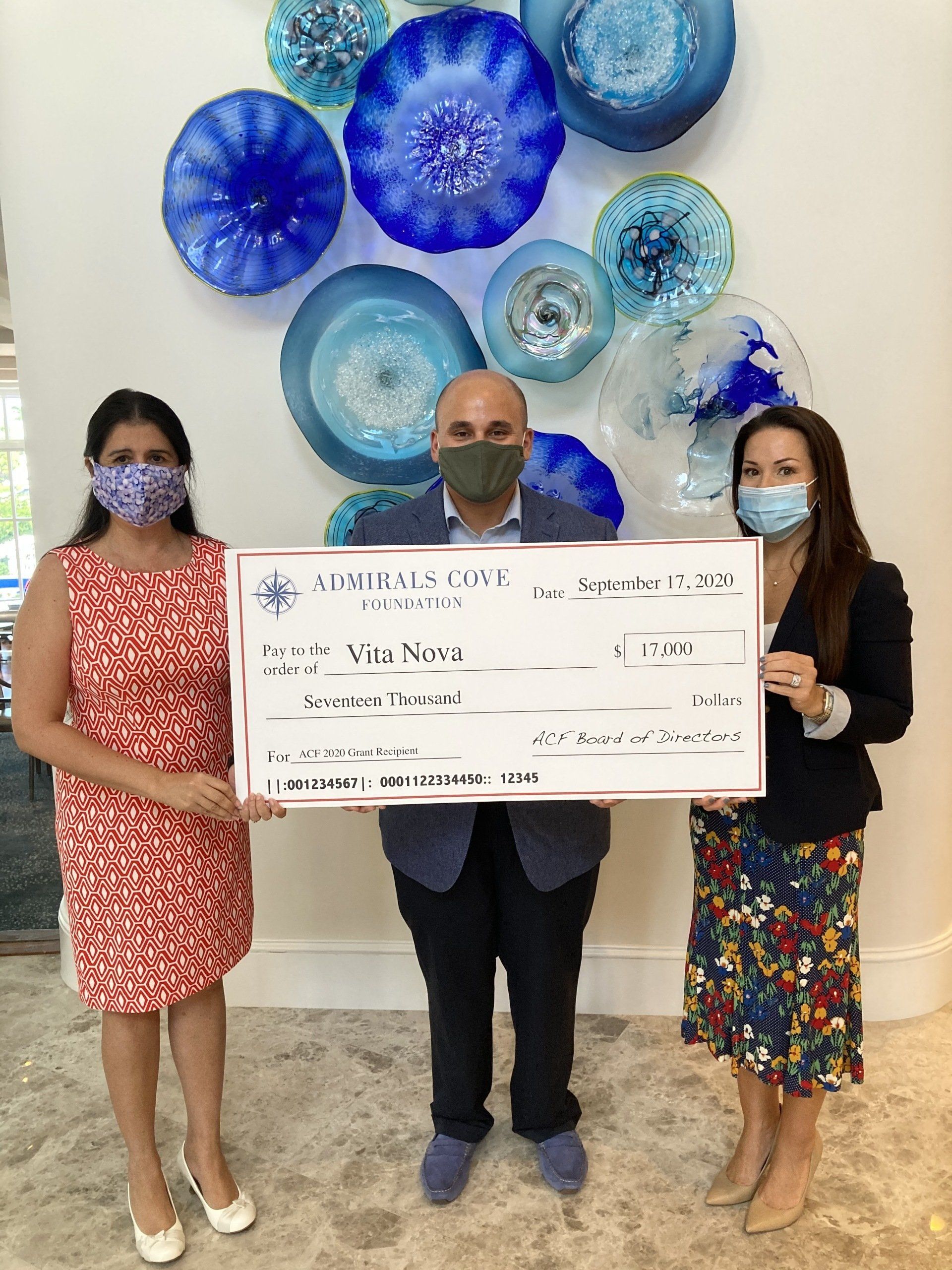 Admirals Cove delivering a check