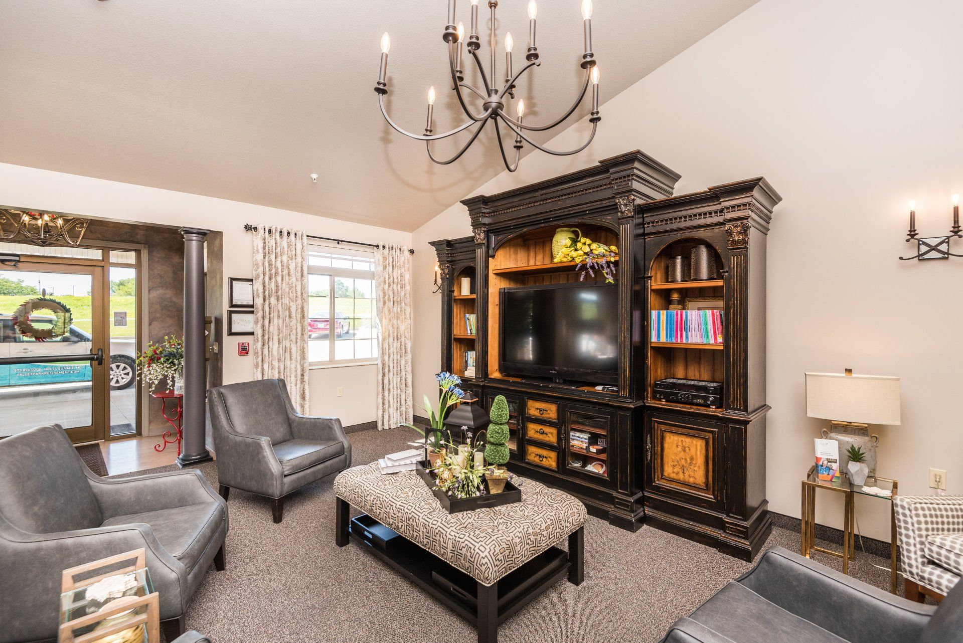A living room filled with furniture and a flat screen tv.