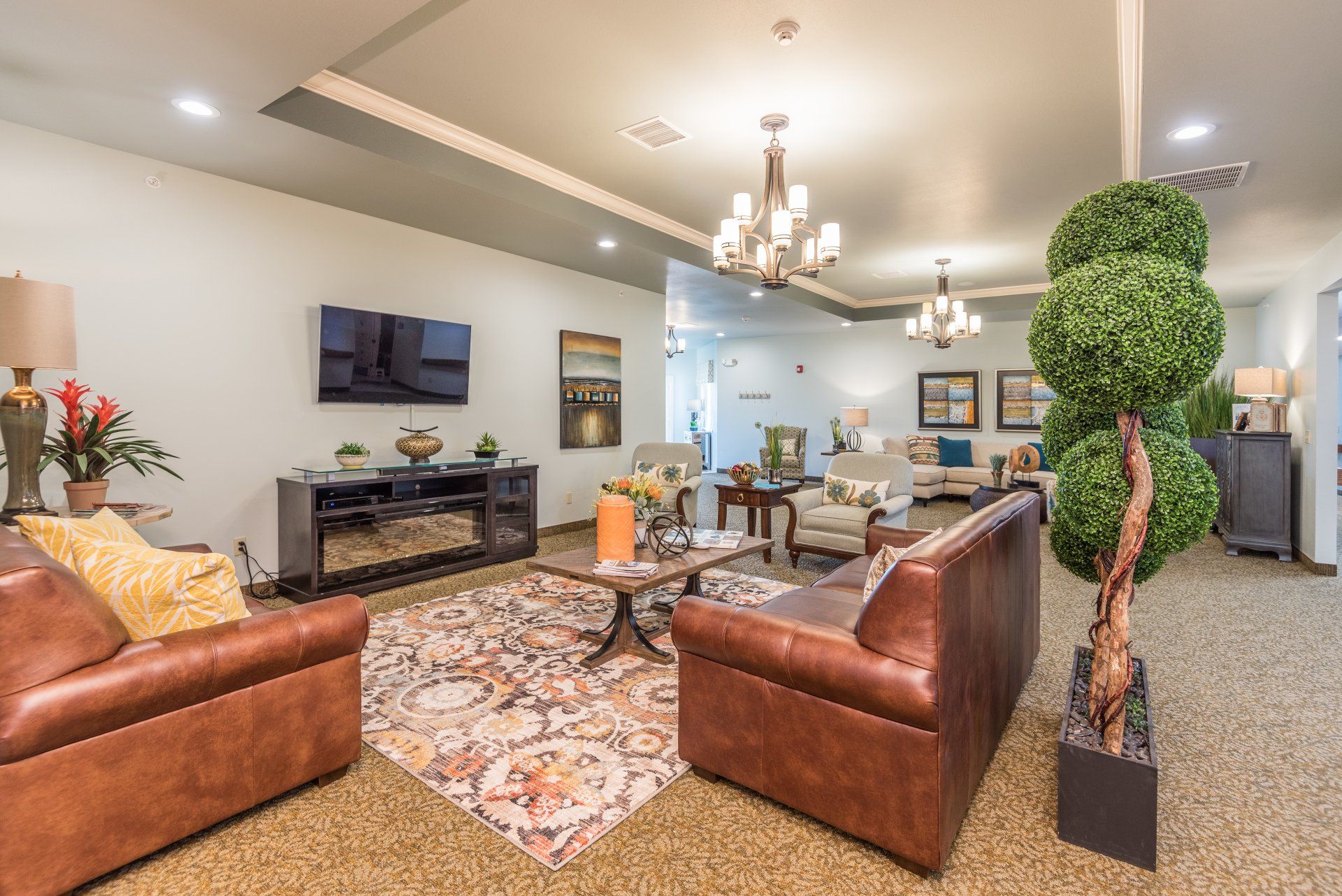 A living room filled with furniture and a television.