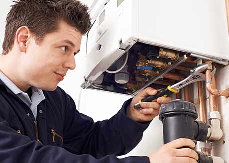 Man Repairing Pipe — Plumber nc in Hickory, NC Man Repairing Pipe — Plumber nc in Hickory, NC