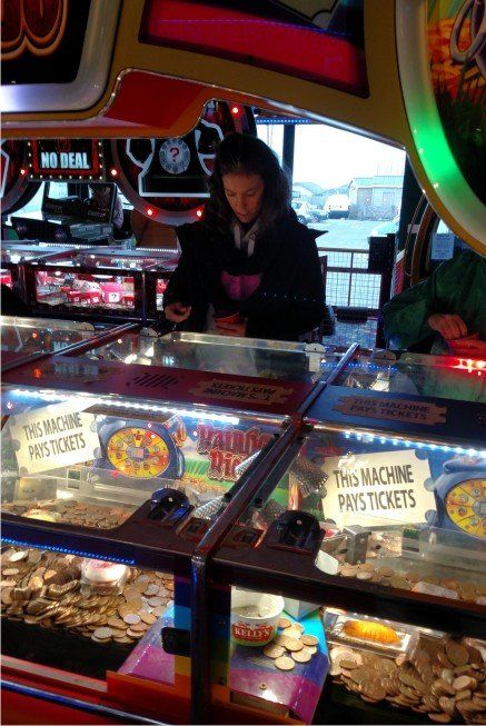 Amusements in Westward Ho! village, Devon, UK include penny pushers, slot machines, skill games, bowling and fruit machines