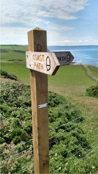 ALMOST THERE! SW Coast path sign just before you drop down to Cornbrough cliffs and the pebble beach looking out to Lundy and Hartland Point