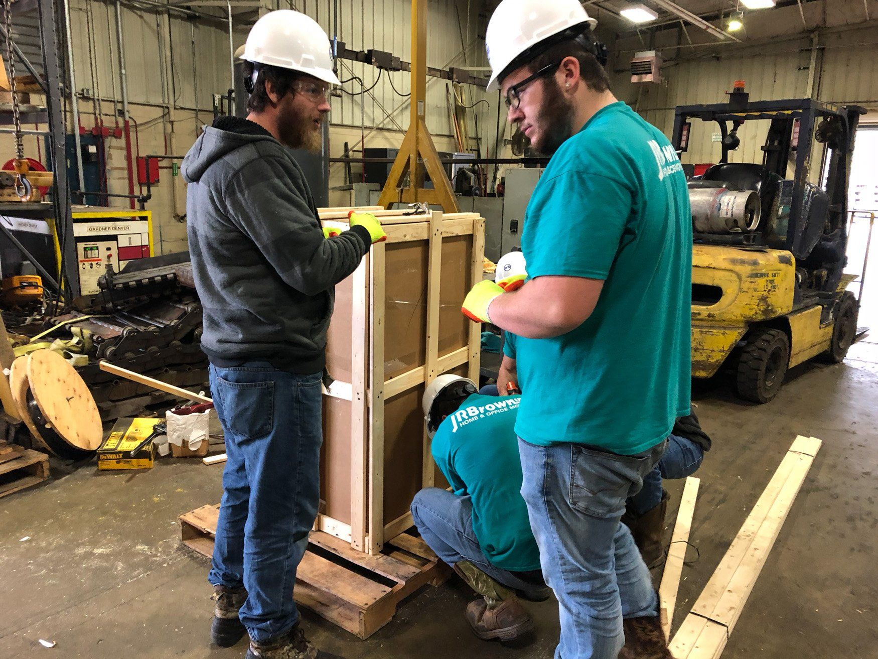 jr brown employees managing movement of industrial equipment