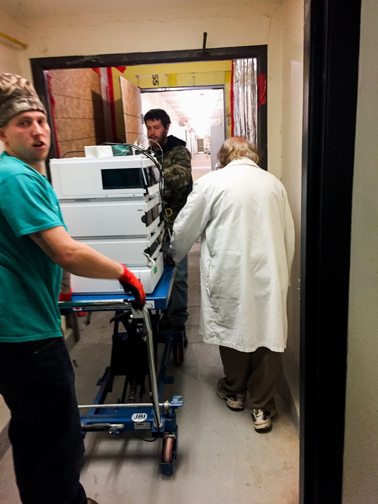 jr brown employees moving medical equipment