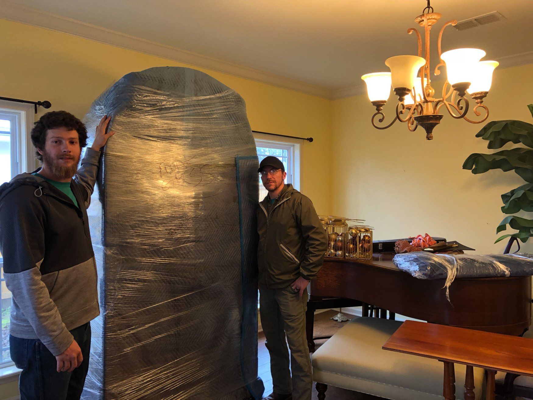jr brown employees securing large item for move