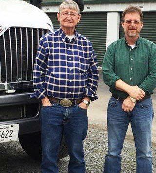 jr brown employees posing in front of truck