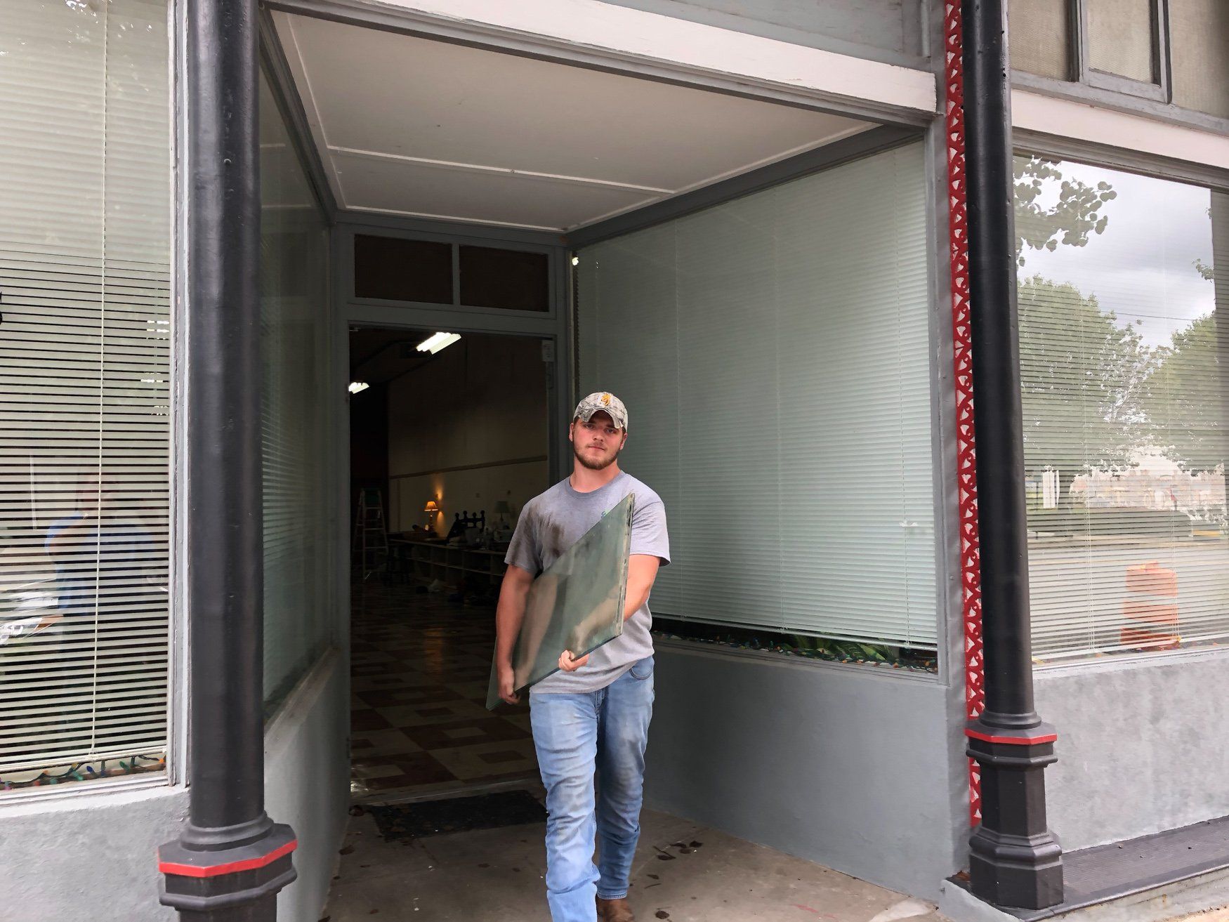 jr brown employee moving cabinet door