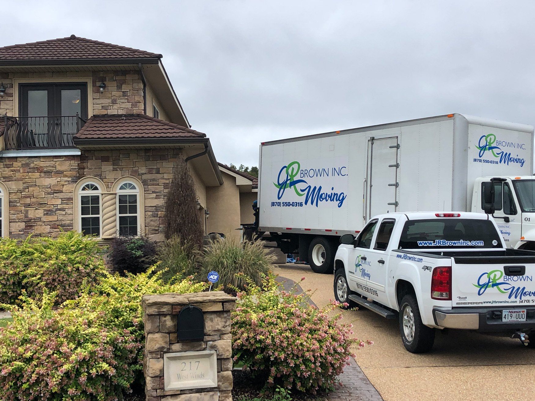 jr brown truck unloading at residence
