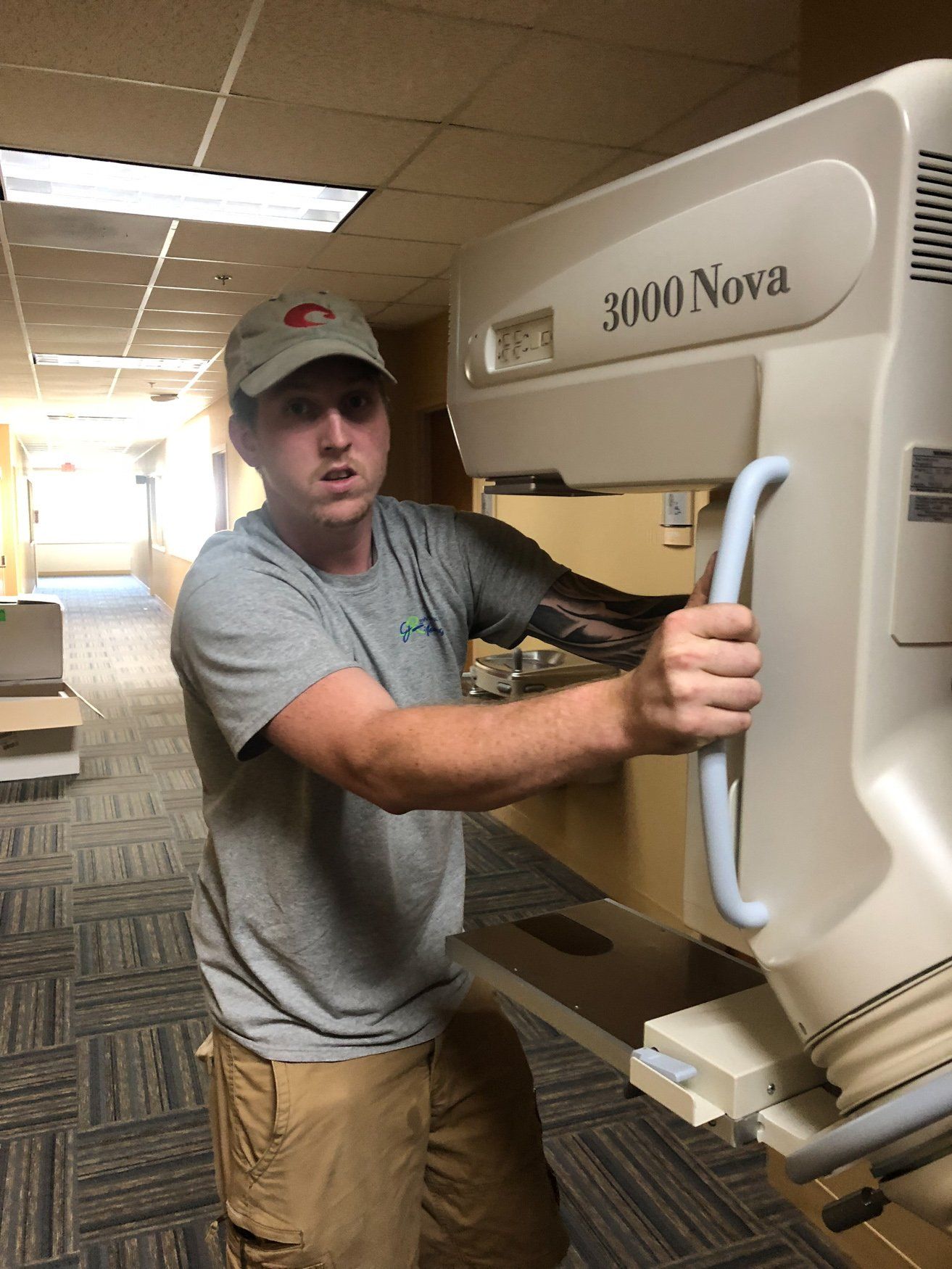 jr brown employee moving medical imaging device