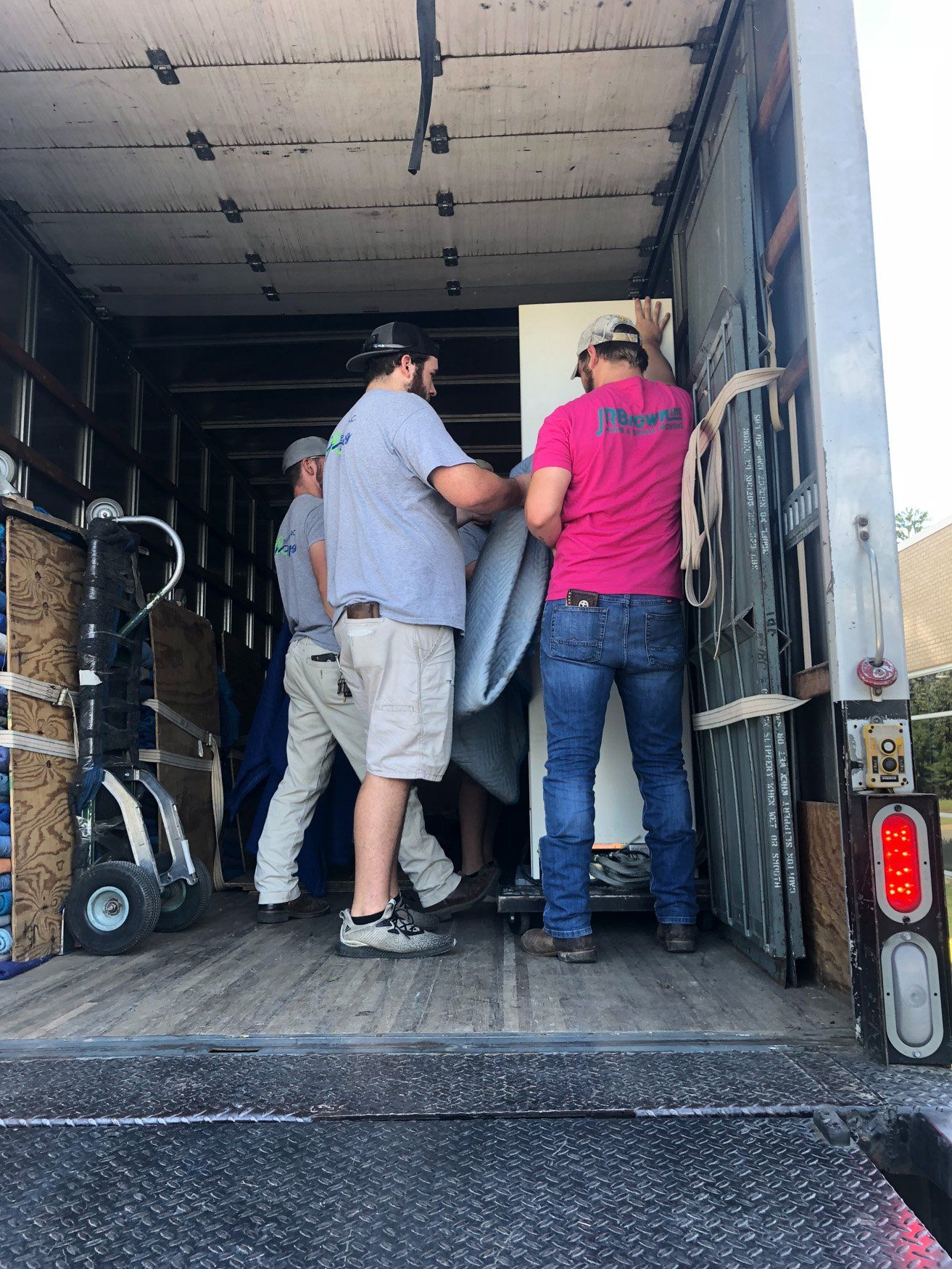 jr brown employees moving medical equipment into truck