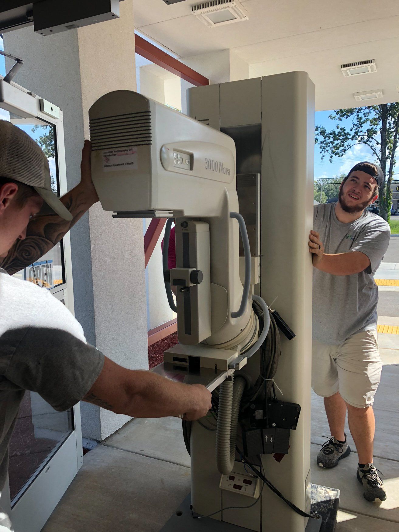 jr brown employees moving xray machine