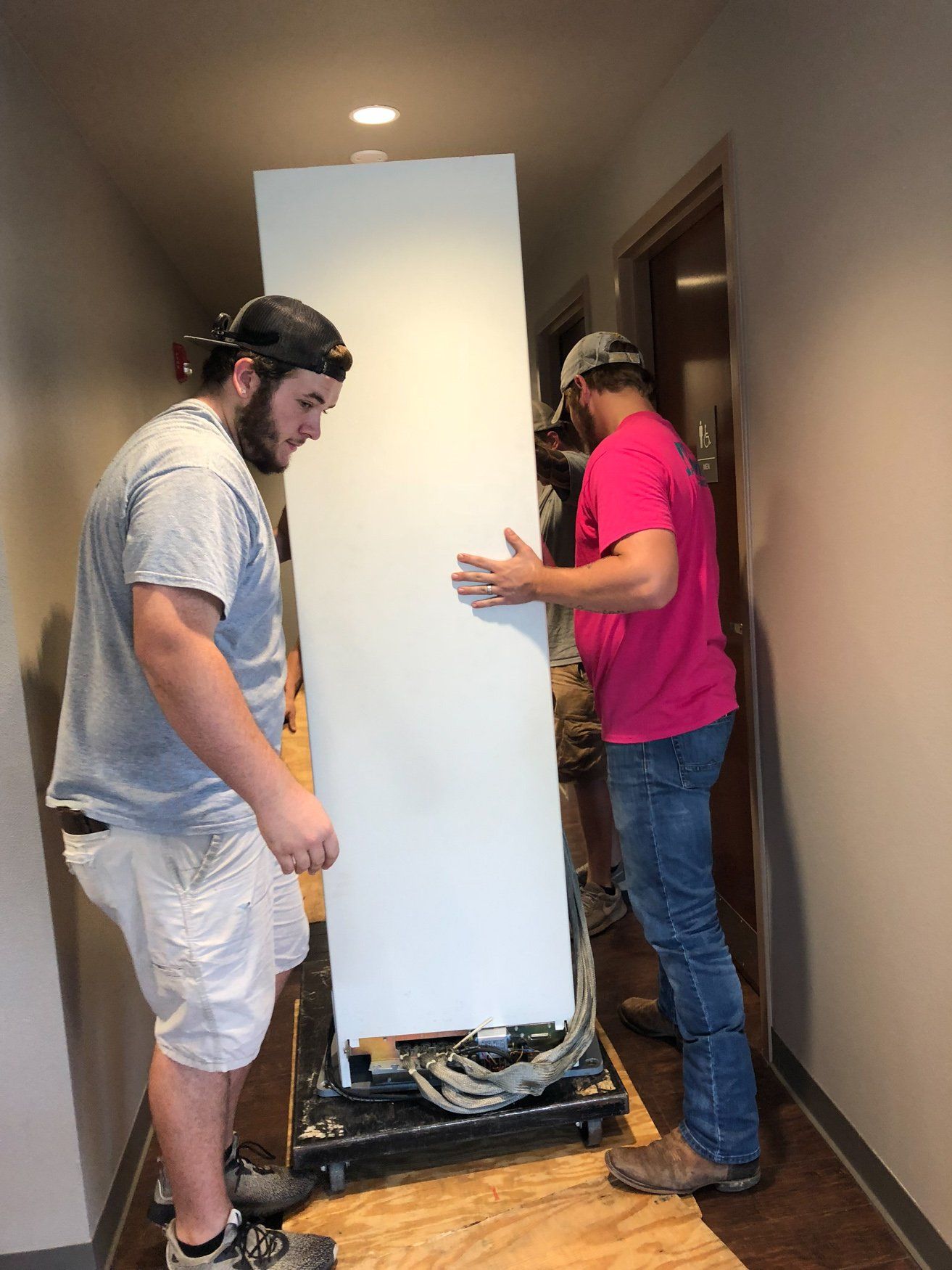 jr brown employees moving metal cabinet