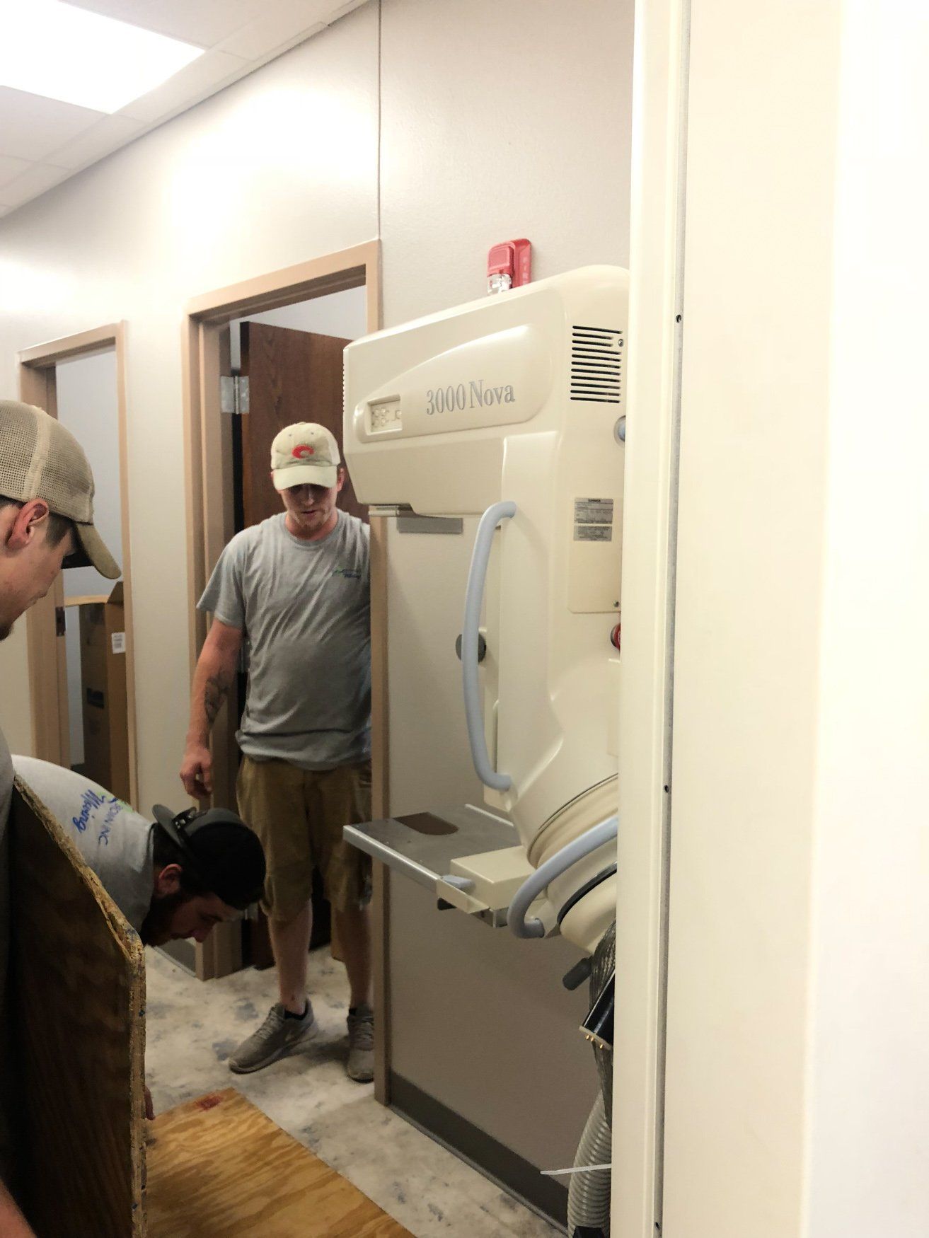 jr brown employees moving medical equipment