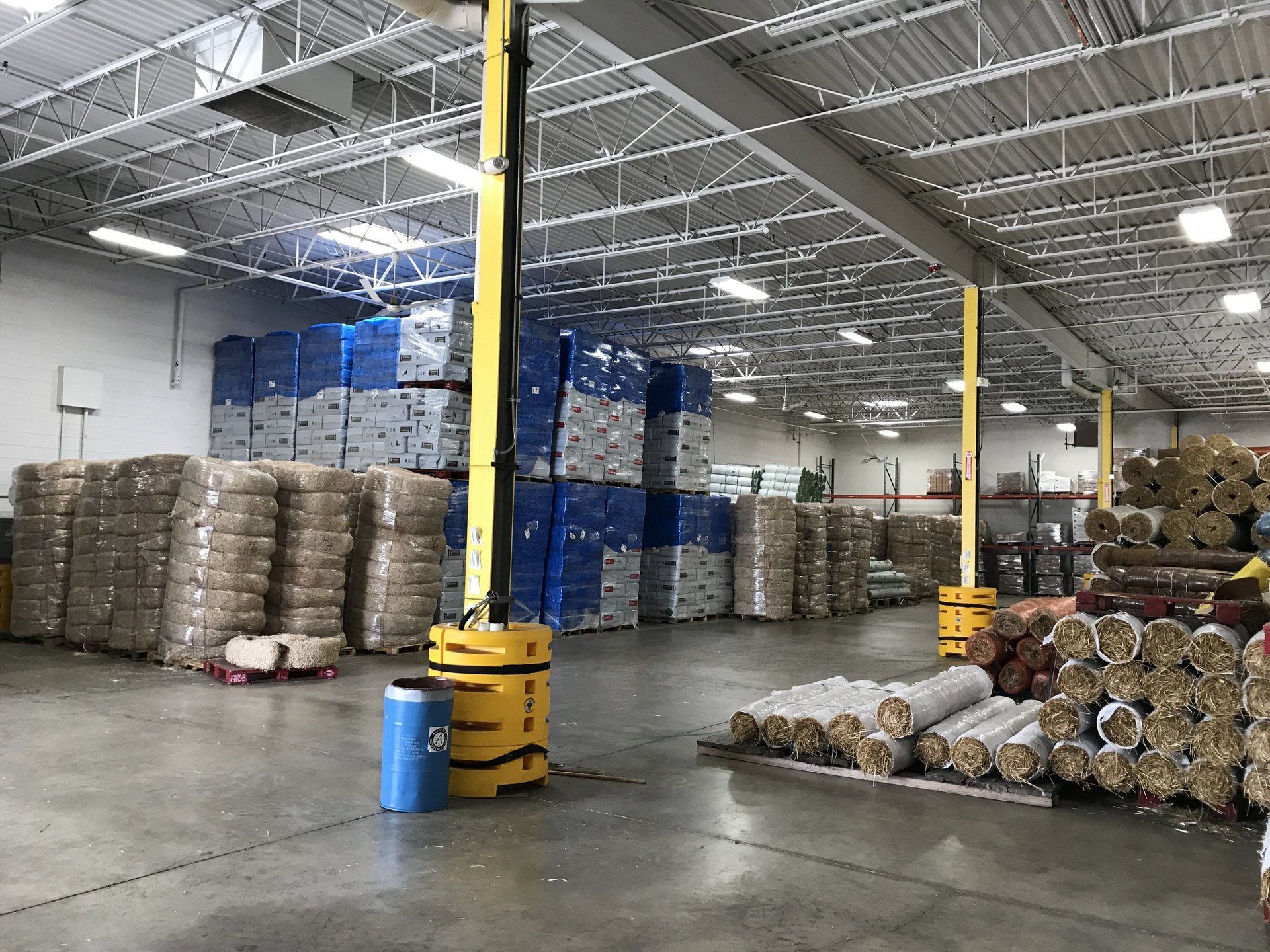 A large warehouse filled with lots of boxes and bags.