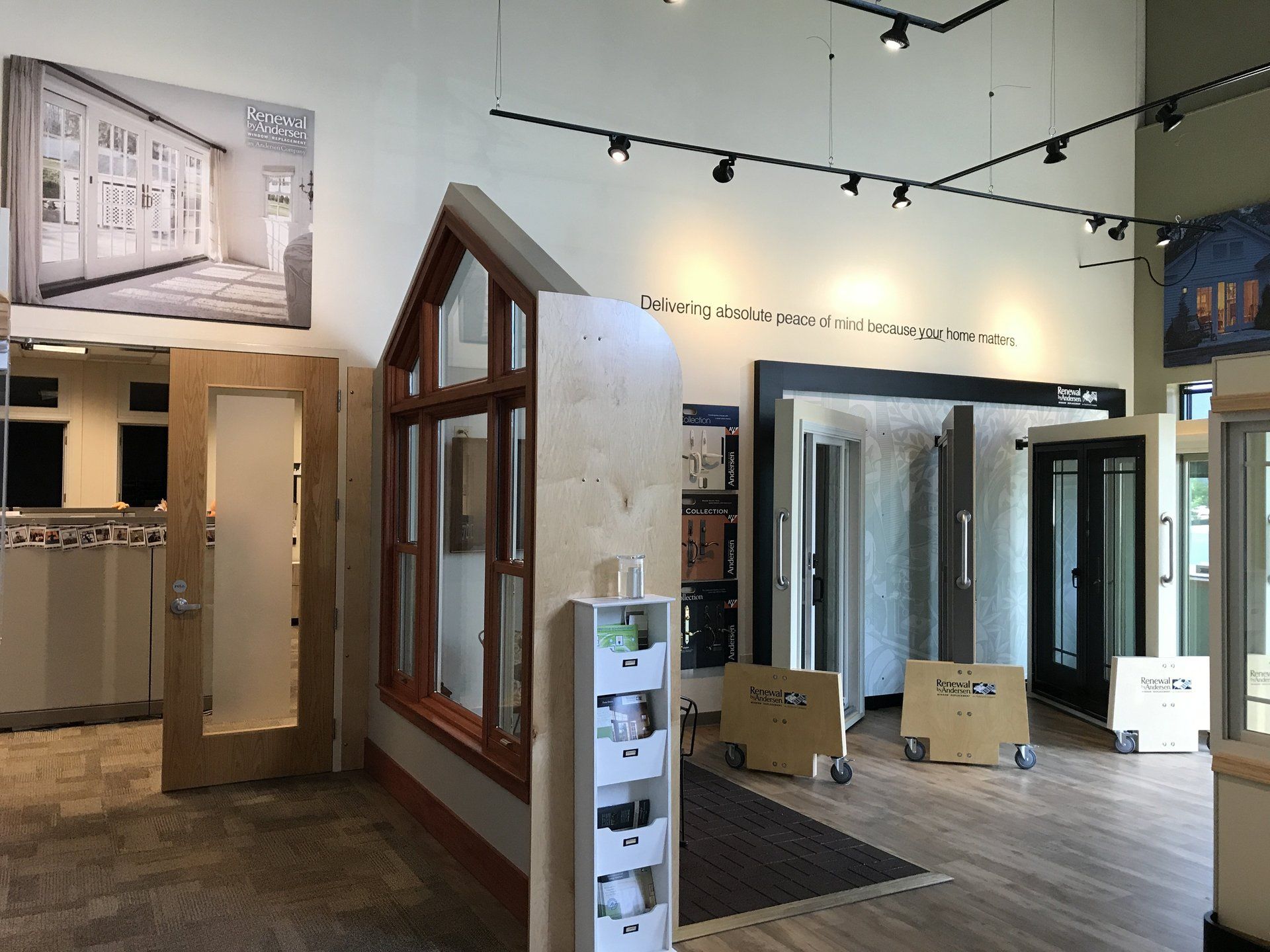 A large room with a lot of windows and doors