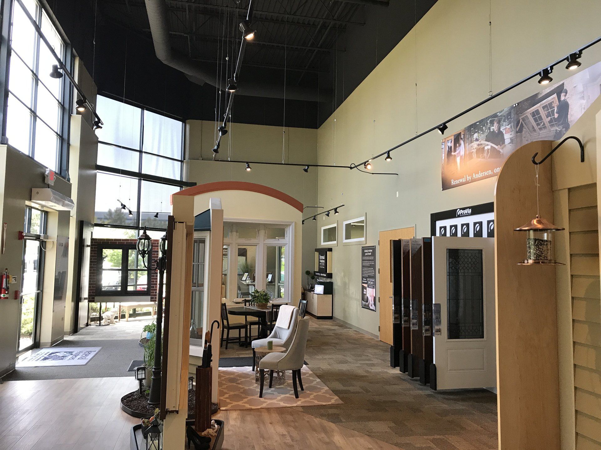 A large room with a lot of windows and doors.