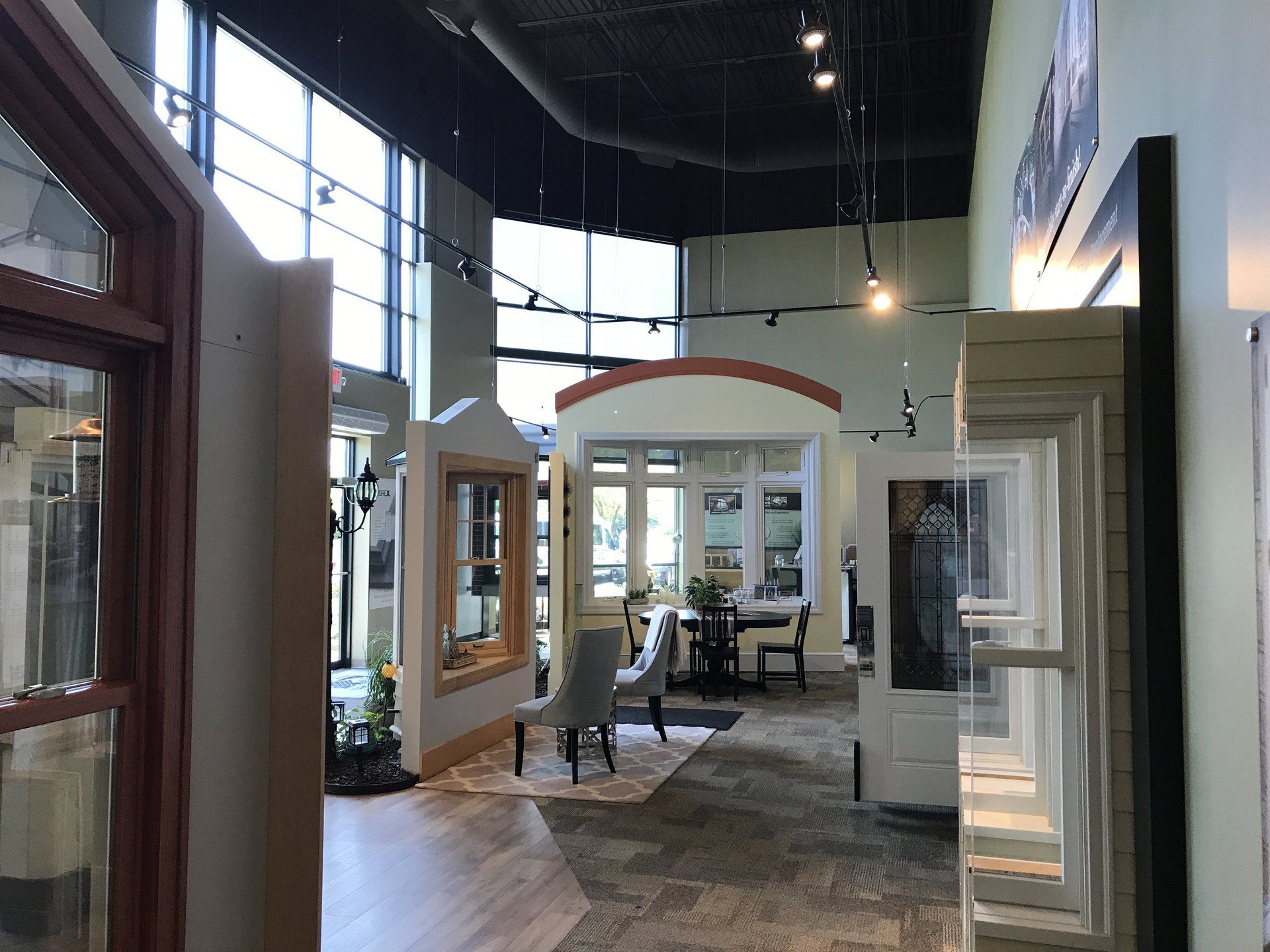 A large room with a lot of windows and doors