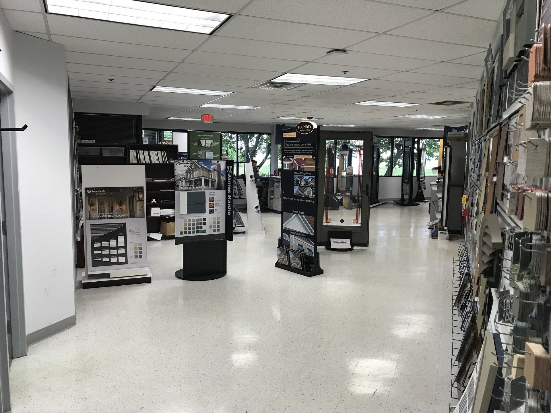 A large room with lots of shelves and displays in a store.