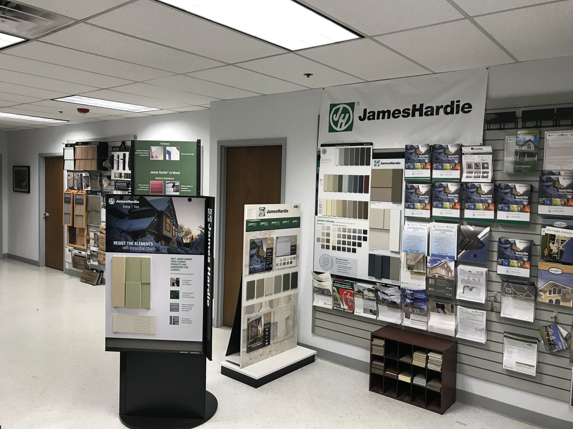 A large room with a sign that says james hardie on it