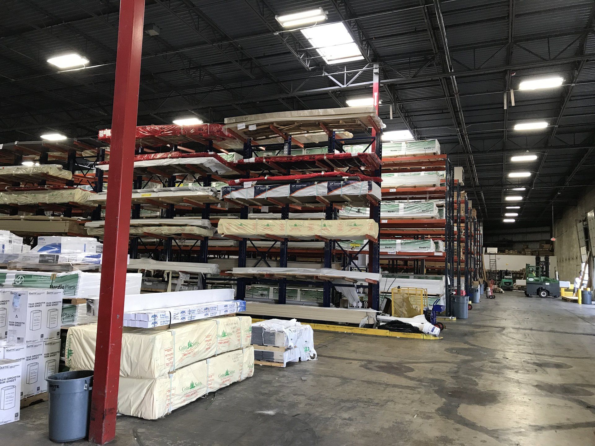 A large warehouse filled with lots of shelves and boxes