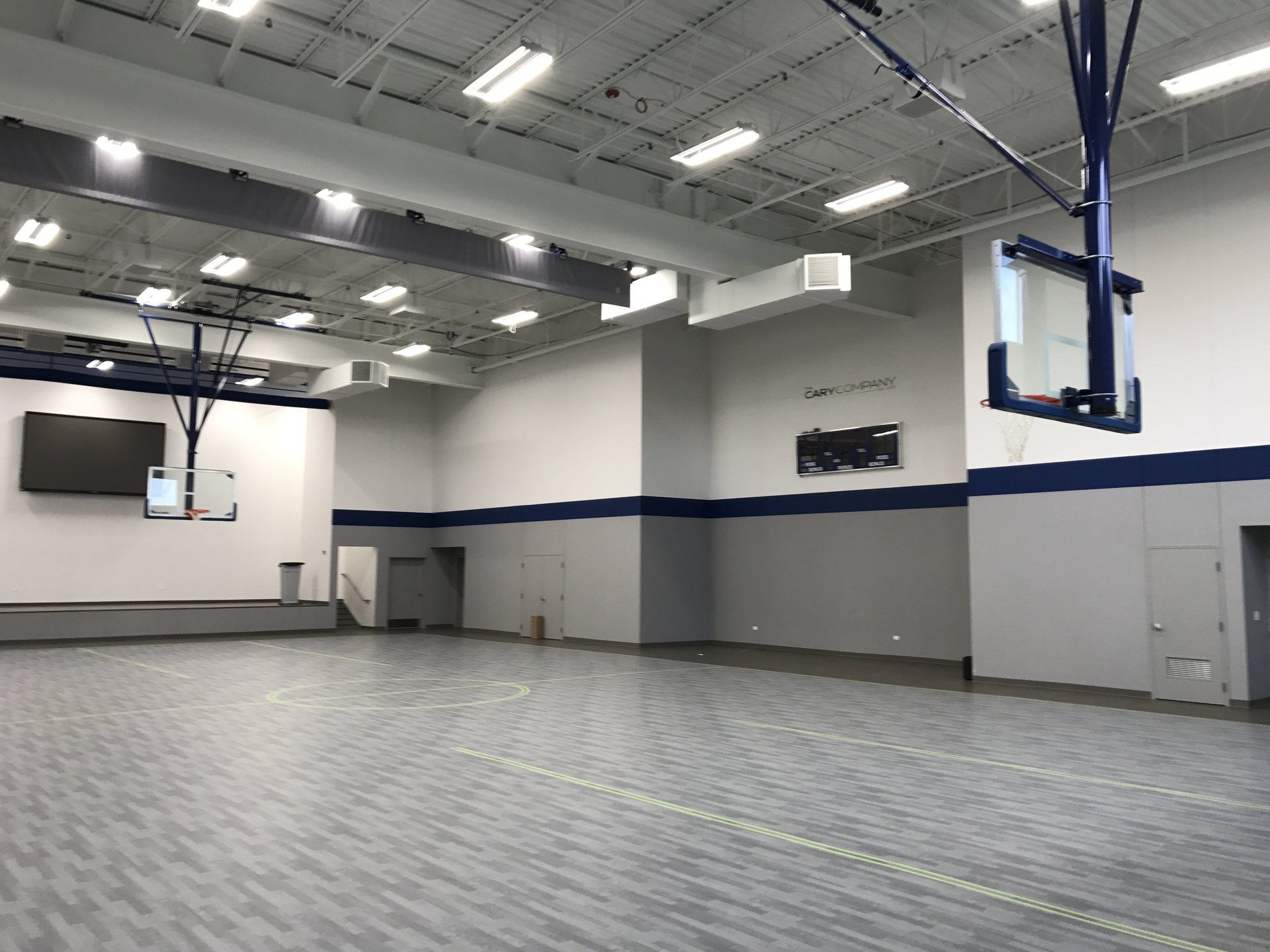 There is a basketball hoop in the middle of the room.