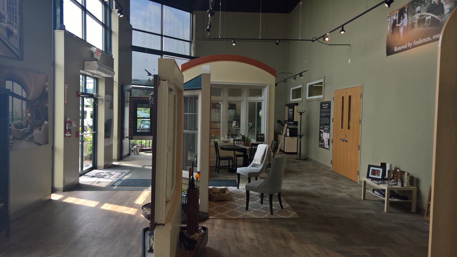 A large room with a lot of windows and chairs in it