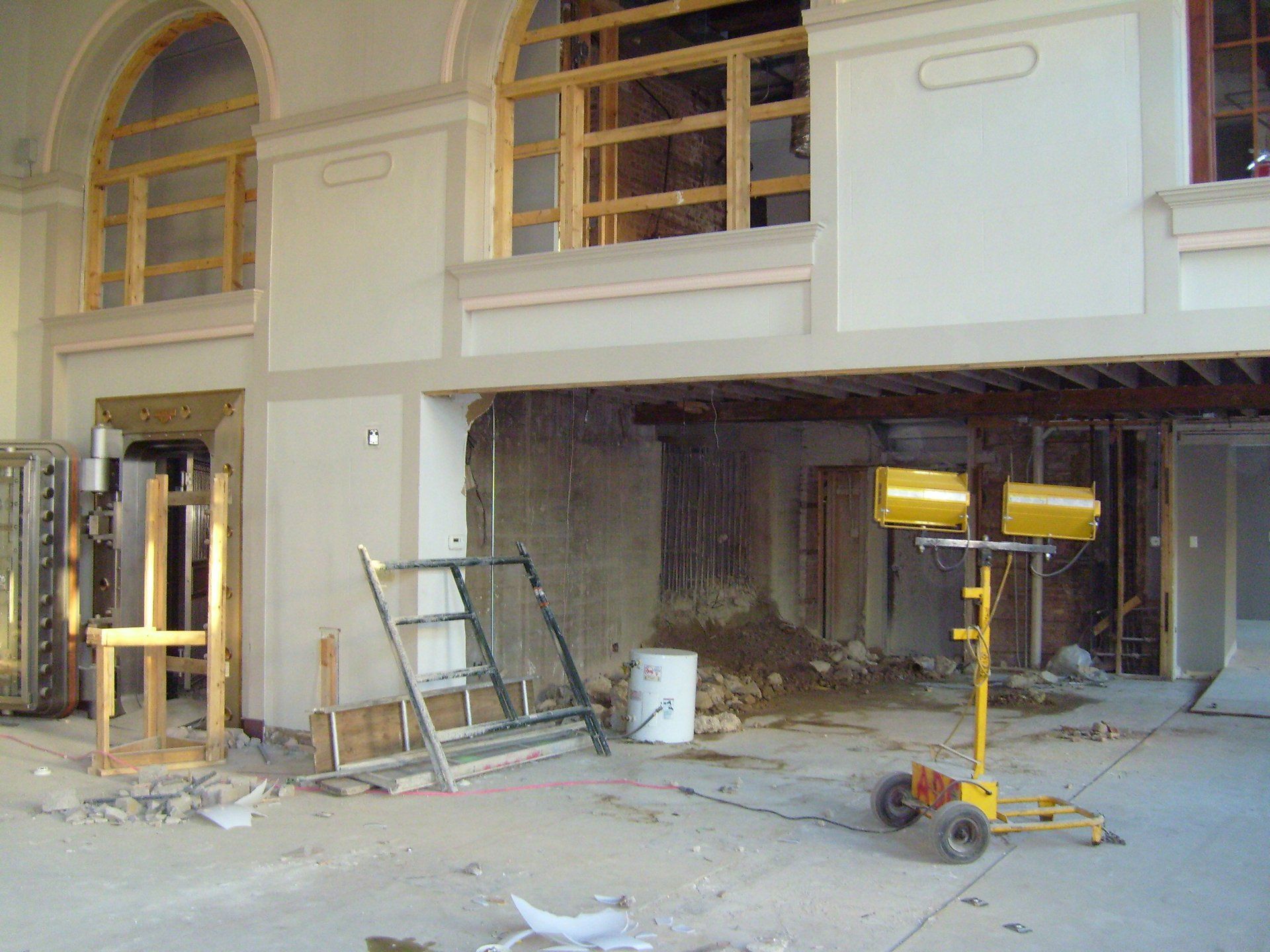 A building under construction with a yellow light on the floor