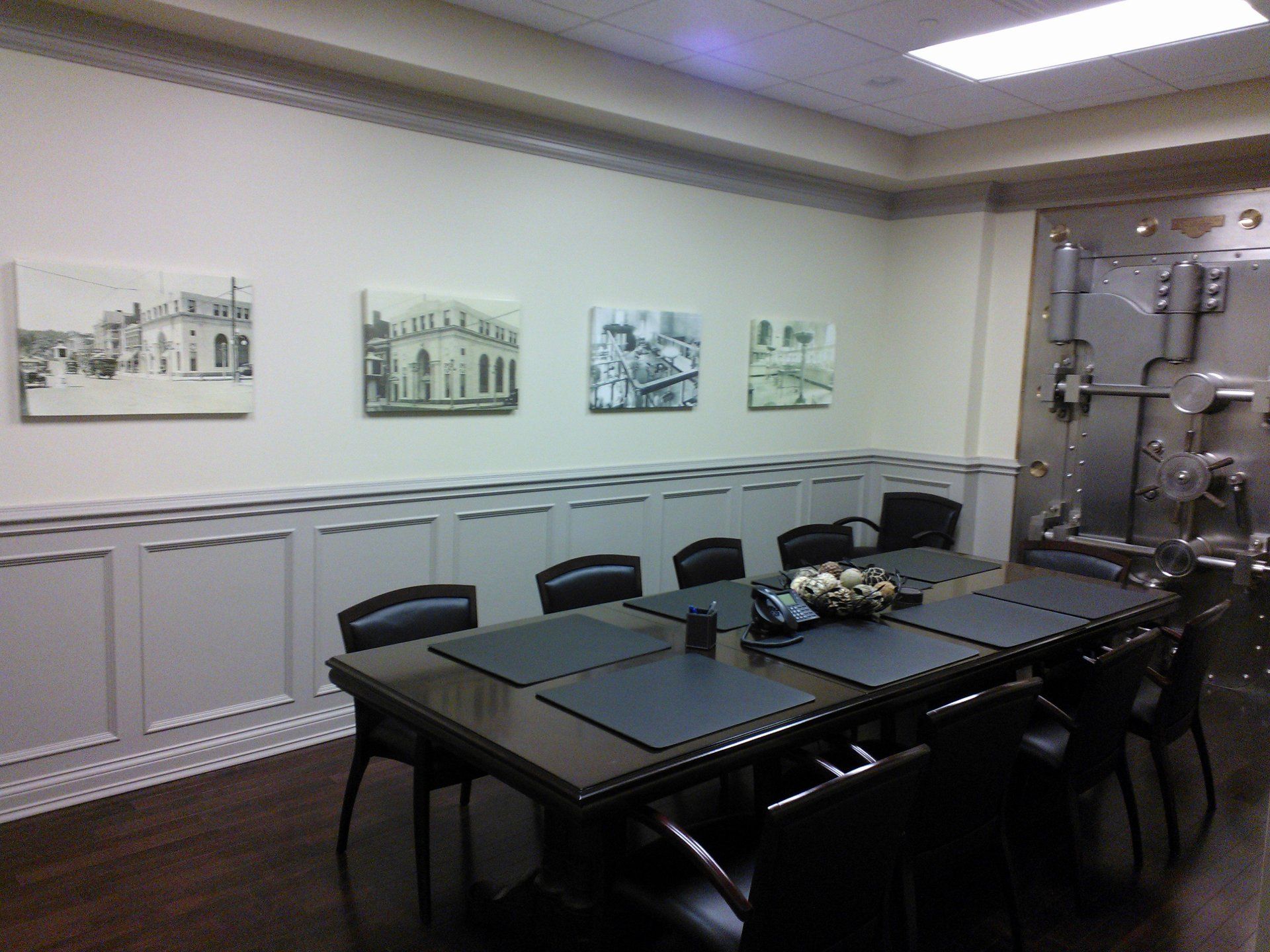 A conference room with a long table and chairs