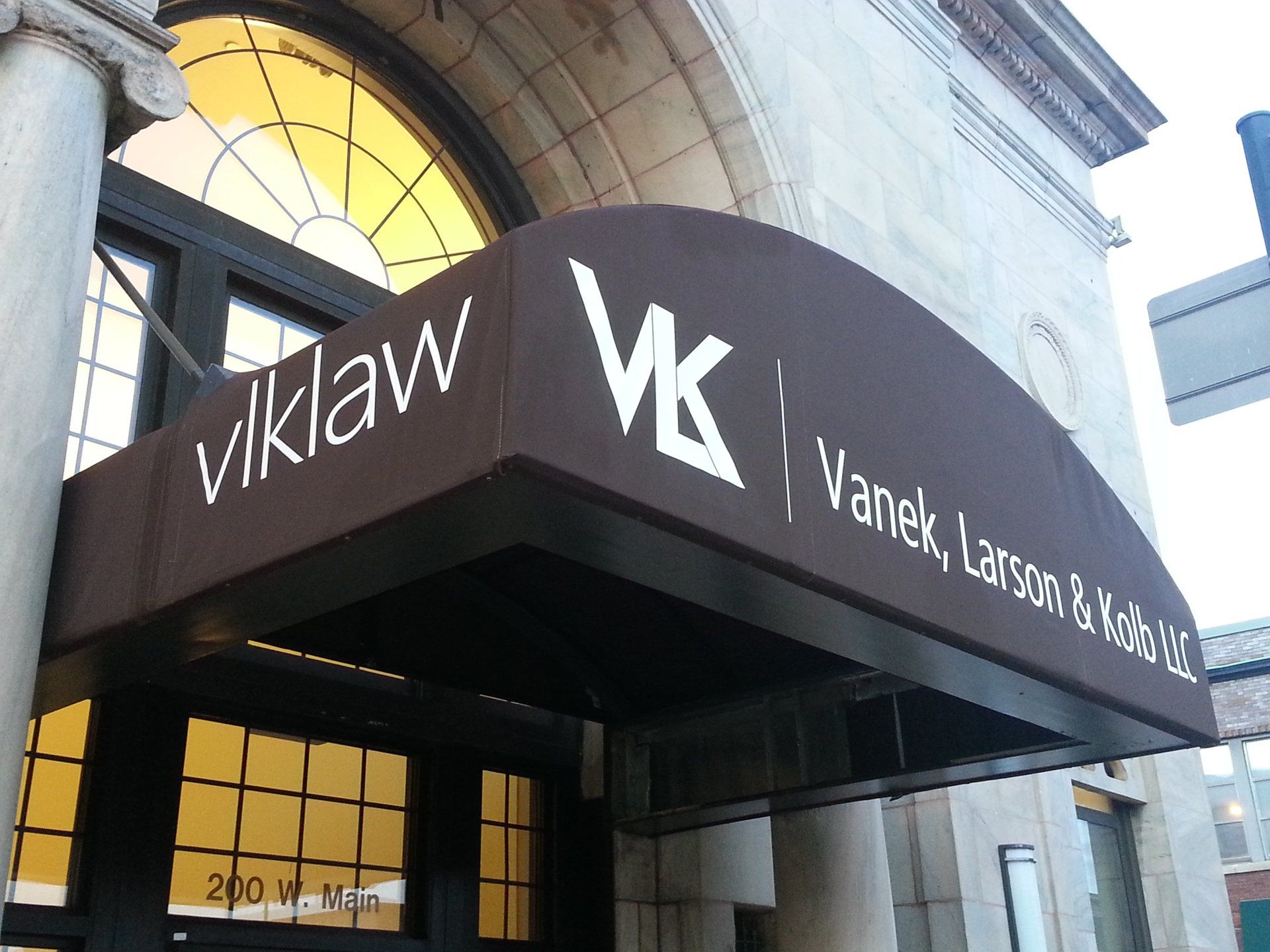 A brown awning that says vklaw on it