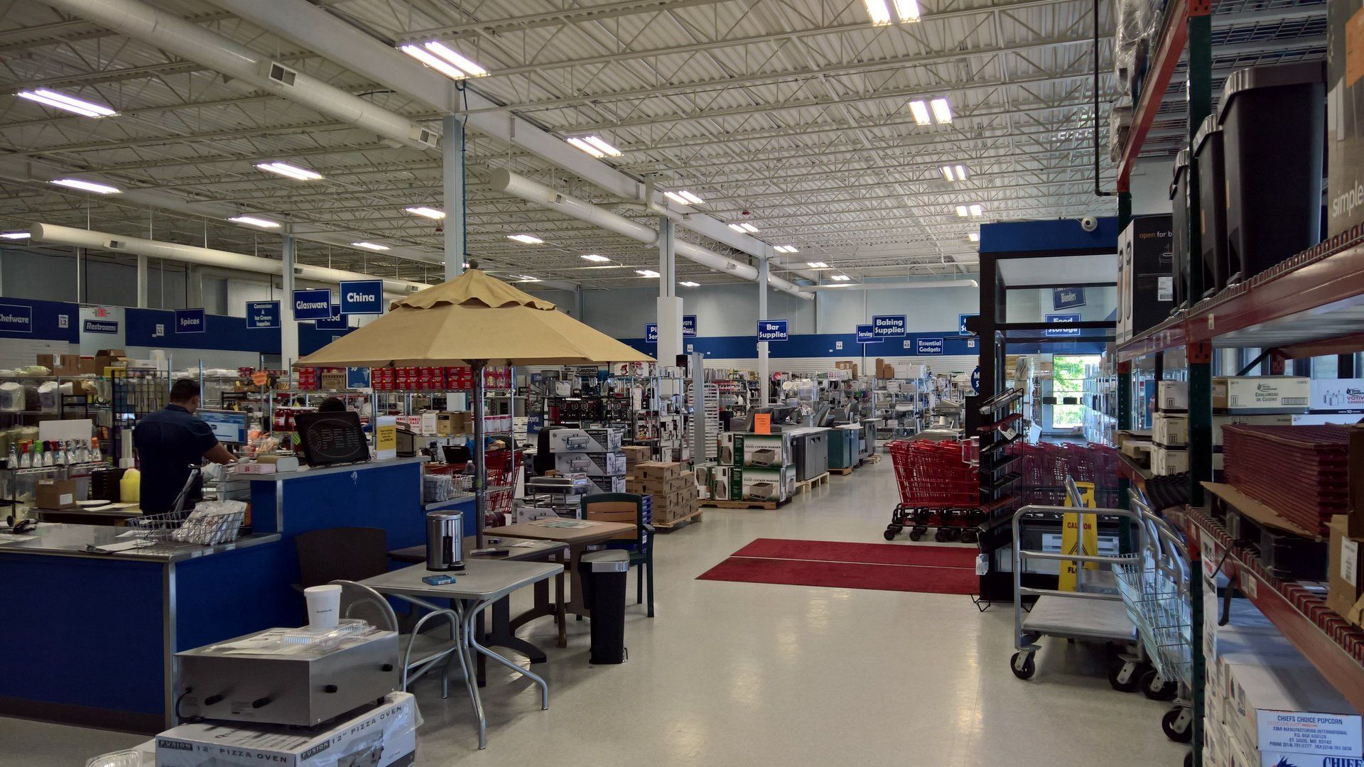 A large store with lots of shelves and tables